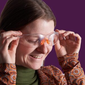 Caucasian female wearing protective safety goggles
