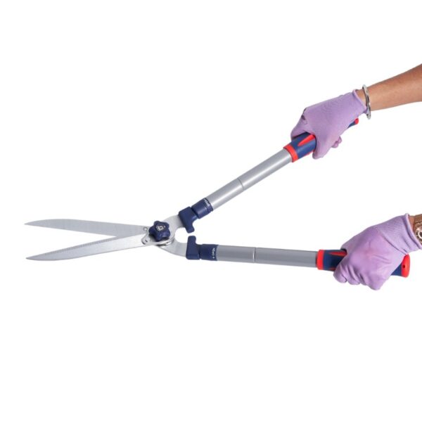 lilac gloved hands holding garden shears