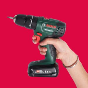 South asian female holding Bosch cordless drill