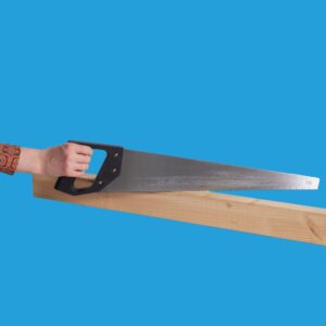 Caucasian female holding large hand saw cutting piece of wood