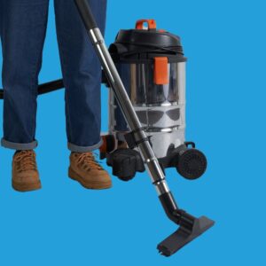 Silver vacuum cleaner on blue background